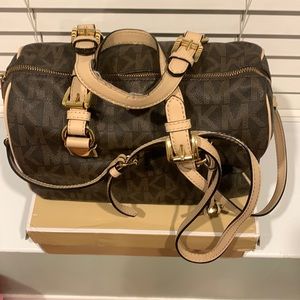 Dark brown and beige Michael Kors crossbody satchel.